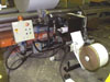 VDR system printing and applying 8-1/2Wx17L labels to the BOTTOM of stretch-wrapped jumbo rolls of paper.